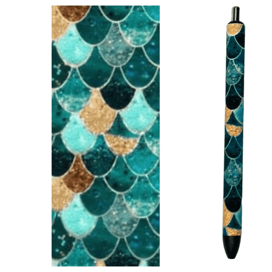 Photo of pen and design wrap with hues of emerald and gold in a fish scale design.