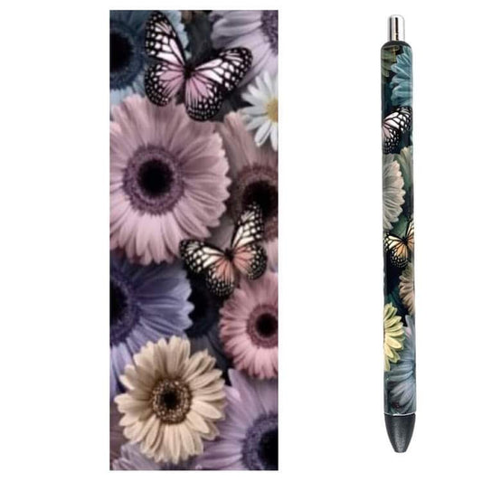 Photo of pen and design wrap with flowers in pink, purple, blue and brown. Small butterflies in front.